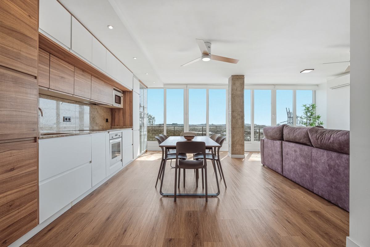 Living and dining room with an exposed concrete pillar