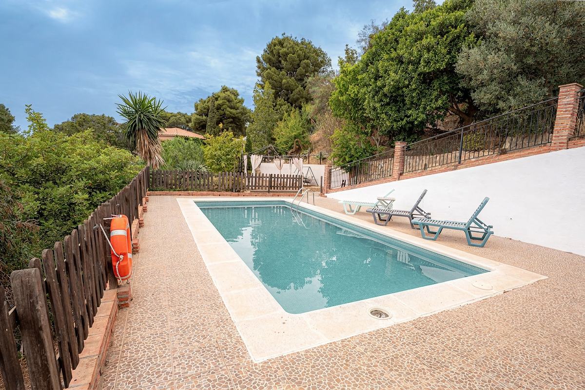 Villa pool with sun loungers and garden, photographed by Lo Bianco Studio